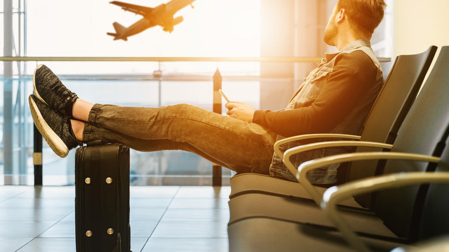 Traveler installing an eSIM on iPhone before boarding